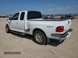 2002 Ford F-150 XL with VIN 1FTRX07W52KB08618, listed as a Copart auction lot 57941974 with 172,843 mi miles and Salvage title. Bid and sale history available at DreamBid. Image 2.
