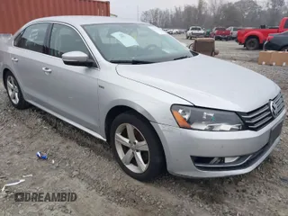 2015 Volkswagen Passat 1.8T Wolfsburg Ed with VIN 1VWAT7A34FC113127, listed as a IAAI auction lot 41211174 with 97,504 mi miles. Bid and sale history available at carsss.com. Image 1.