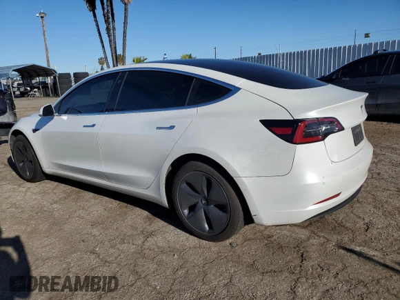 2020 Tesla Model 3 Standard Range Plus with VIN 5YJ3E1EA5LF660417, listed as a Copart auction lot 48144125 with 112,924 mi miles and Salvage Title. Bid and sale history available at DreamBid. Image 2.