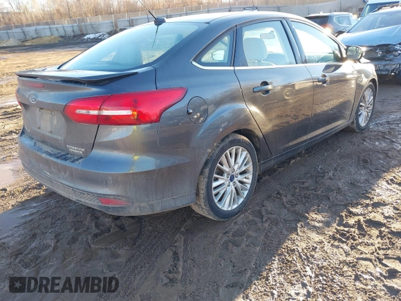2015 Ford Focus Titanium with VIN 1FADP3J28FL348625, listed as a IAAI auction lot 41674741 with 223,585 mi miles and . Bid and sale history available at carsss.com. Image 4.