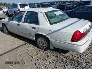 2004 Mercury Grand Marquis GS z VIN 2MEFM74W74X654151, wystawiony jako IAAI lot #42185493 z przebiegiem 203 017 mil mil oraz . Historia ofert i sprzedaży dostępna na DreamBid. Obrazek 3.