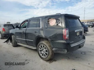 2015 GMC Yukon Denali with VIN 1GKS1CKJ2FR699959, listed as a Copart auction lot 42035195 with 0 mi miles and Salvage Title. Bid and sale history available at carsss.com. Image 2.