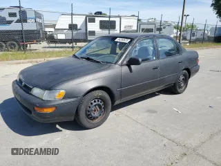 1994 Toyota Corolla Deluxe with VIN 1NXAE09B6RZ198403, listed as a Copart auction lot 54260835 with 273,034 mi miles and Salvage title. Bid and sale history available at DreamBid. Image 1.