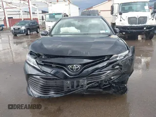 2019 Toyota Camry LE with VIN 4T1B11HK2KU263910, listed as a IAAI auction lot 42060008 with 31,433 mi miles and . Bid and sale history available at DreamBid. Image 6.