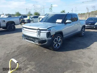 2024 Rivian R1T Adventure with VIN 7FCTGBAA8RN034001, listed as a IAAI auction lot 41101359 with 6,490 mi miles. Bid and sale history available at carsss.com. Image 17.