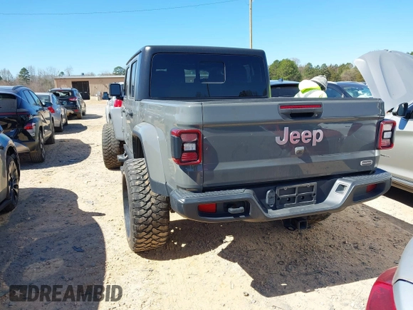 2020 Jeep Gladiator Overland z VIN 1C6HJTFG4LL143369, wystawiony jako IAAI lot #41827409 z przebiegiem 77 752 mil mil oraz . Historia ofert i sprzedaży dostępna na DreamBid. Obrazek 3.