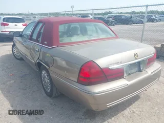 2003 Mercury Grand Marquis GS Convenience z VIN 2MEFM74W33X637135, wystawiony jako IAAI lot #42001834 z przebiegiem 146 184 mil mil oraz . Historia ofert i sprzedaży dostępna na DreamBid. Obrazek 3.