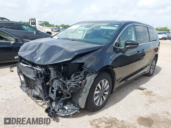 2023 Chrysler Pacifica Hybrid Touring L with VIN 2C4RC1L75PR611901, listed as a IAAI auction lot 42626500 with 44,156 mi miles and . Bid and sale history available at DreamBid. Image 2.
