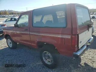 1988 Ford Bronco с VIN 1FMCU12T0JUD60132, выставлен на аукционе Copart как лот 81643864 с пробегом 9 594 миль миль и Чистый • Clean title. История ставок и продаж доступна на DreamBid. Изображение 2.