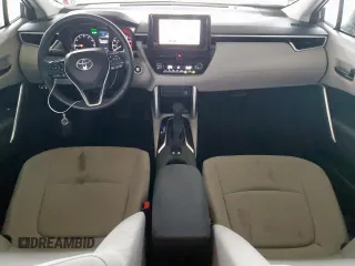 2023 Toyota Corolla Cross LE with VIN 7MUBAAAG4PV042580, listed as a Copart auction lot 63797305 with 59,576 mi miles and Salvage title. Bid and sale history available at DreamBid. Image 8.