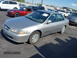 1999 Honda Accord LX with VIN JHMCG6650XC011621, listed as a IAAI auction lot 42401527 with 243,227 mi miles and . Bid and sale history available at DreamBid. Image 2.