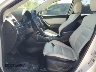 2016 Mazda CX-5 Grand Touring with VIN JM3KE4DY0G0819528, listed as a Copart auction lot 52343885 with 77,340 mi miles and Clean Title. Bid and sale history available at DreamBid. Image 7.