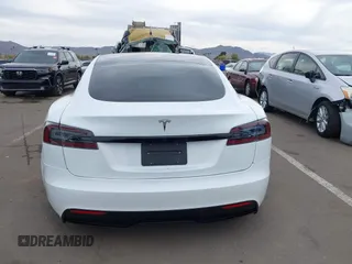 2021 Tesla Model S Long Range with VIN 5YJSA1E57MF453815, listed as a IAAI auction lot 41818700 with 51,176 mi miles and . Bid and sale history available at DreamBid. Image 17.