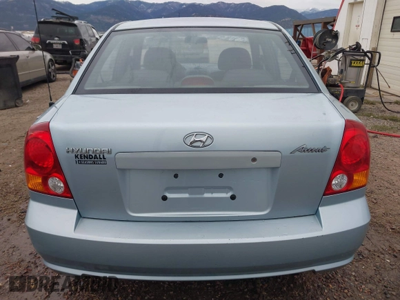 2003 Hyundai Accent GL z VIN KMHCG45C43U465523, wystawiony jako IAAI lot #40883056 z przebiegiem 95 770 mil mil oraz . Historia ofert i sprzedaży dostępna na DreamBid. Obrazek 16.