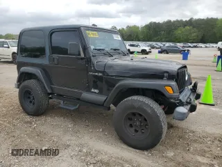 2002 Jeep Wrangler Sahara with VIN 1J4FA59S22P771136, listed as a Copart auction lot 51528665 with 236,882 mi miles and Salvage title. Bid and sale history available at DreamBid. Image 4.
