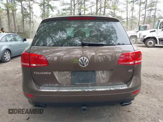 2014 Volkswagen Touareg Sport with VIN WVGEF9BP2ED007904, listed as a IAAI auction lot 41960811 with 126,230 mi miles and . Bid and sale history available at DreamBid. Image 16.