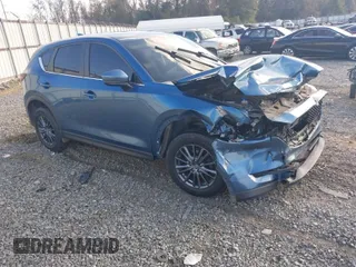 2020 Mazda CX-5 Touring with VIN JM3KFACM0L0775020, listed as a IAAI auction lot 40876970 with 96,424 mi miles. Bid and sale history available at carsss.com. Image 1.