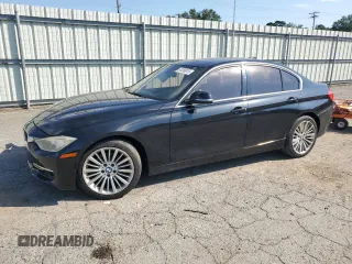 2012 BMW 3 Series 328i with VIN WBA3A5C58CF348710, listed as a Copart auction lot 61266815 with 112,720 mi miles and Salvage title. Bid and sale history available at DreamBid. Image 1.