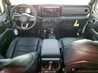 2024 Jeep Wrangler Sahara with VIN 1C4PJXEN6RW106911, listed as a Copart auction lot 58937945 with 13,948 mi miles and Salvage title. Bid and sale history available at DreamBid. Image 8.