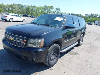 2011 Chevrolet Suburban LTZ with VIN 1GNSCKE01BR275919, listed as a IAAI auction lot 42038399 with 247,841 mi miles. Bid and sale history available at carsss.com. Image 2.