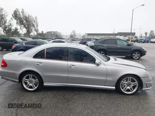 2003 Mercedes-Benz E-Class 5.5L AMG with VIN WDBUF76J93A351317, listed as a IAAI auction lot 41573446 with 144,119 mi miles. Bid and sale history available at carsss.com. Image 13.