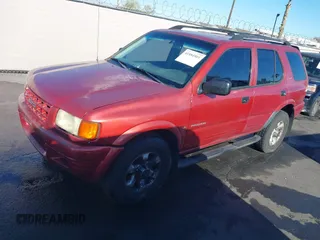 1999 Isuzu Rodeo S z VIN 4S2CK58W3X4307201, wystawiony jako IAAI lot #41884901 z przebiegiem 236 970 mil mil oraz . Historia ofert i sprzedaży dostępna na DreamBid. Obrazek 2.