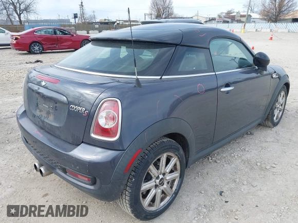 2013 MINI Coupe S with VIN WMWSX3C50DT466882, listed as a IAAI auction lot 42026938 with 99,499 mi miles and . Bid and sale history available at DreamBid. Image 4.