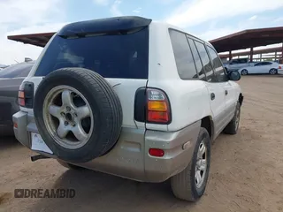 1998 Toyota RAV4 with VIN JT3GP10V3W7038970, listed as a IAAI auction lot 42377816 with 221,365 mi miles and . Bid and sale history available at DreamBid. Image 4.