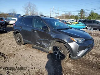 2018 Toyota RAV4 Hybrid SE with VIN JTMJJREV5JD210274, listed as a Copart auction lot 52450645 with 108,249 mi miles and Salvage title. Bid and sale history available at DreamBid. Image 4.