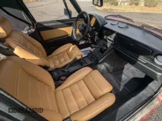 1988 Alfa Romeo Spider z VIN ZARBC5767J1056025, wystawiony jako Copart lot #58116455 z przebiegiem 78 443 mil mil oraz Tytuł czysty. Historia ofert i sprzedaży dostępna na DreamBid. Obrazek 5.