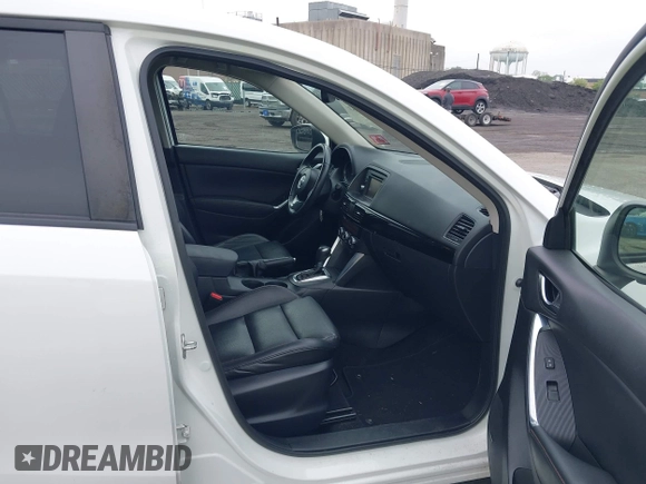 2015 Mazda CX-5 Grand Touring with VIN JM3KE4DY5F0530854, listed as a IAAI auction lot 42274582 with 144,732 mi miles and . Bid and sale history available at DreamBid. Image 5.