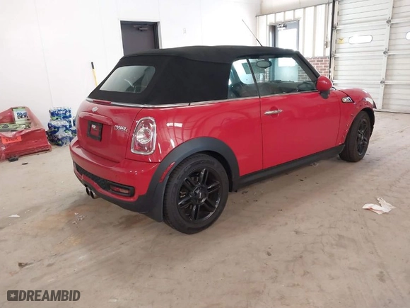 2014 MINI Cooper Convertible S with VIN WMWZP3C59ET298305, listed as a IAAI auction lot 41679657 with 77,736 mi miles. Bid and sale history available at carsss.com. Image 4.