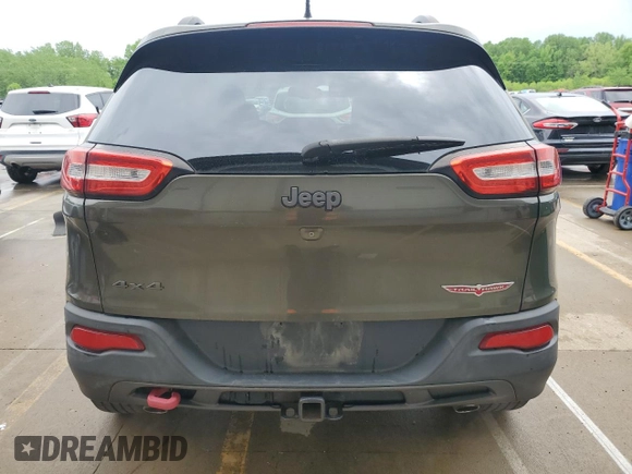2015 Jeep Cherokee Trailhawk z VIN 1C4PJMBSXFW588030, wystawiony jako Copart lot #55057635 z przebiegiem 116 209 mil mil oraz Szkoda całkowita • Salvage title. Historia ofert i sprzedaży dostępna na DreamBid. Obrazek 6.
