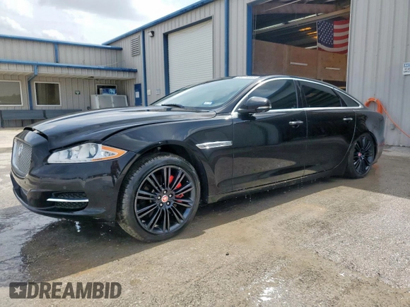 2014 Jaguar XJ Portfolio with VIN SAJWA2GZ2E8V64993, listed as a Copart auction lot 88774965 with 78,689 mi miles and Salvage title. Bid and sale history available at DreamBid. Image 1.