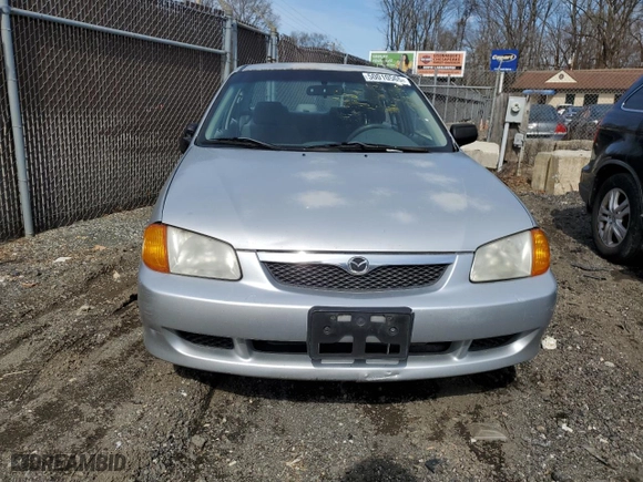 2000 Mazda Protege DX with VIN JM1BJ222XY0199683, listed as a Copart auction lot 50010565 with 139,428 mi miles and Salvage Title. Bid and sale history available at carsss.com. Image 5.