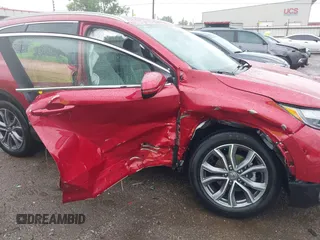 2021 Honda CR-V Touring with VIN 2HKRW2H9XMH663315, listed as a IAAI auction lot 42188893 with 26,203 mi miles and . Bid and sale history available at DreamBid. Image 6.