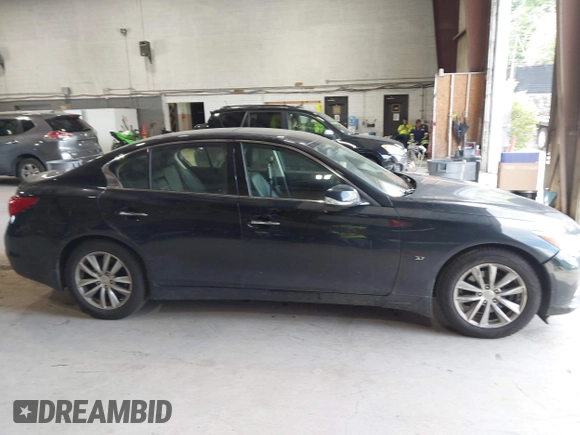 2015 Infiniti Q50 Premium z VIN JN1BV7AR9FM423471, wystawiony jako IAAI lot #42641857 z przebiegiem 86 919 mil mil oraz . Historia ofert i sprzedaży dostępna na DreamBid. Obrazek 13.