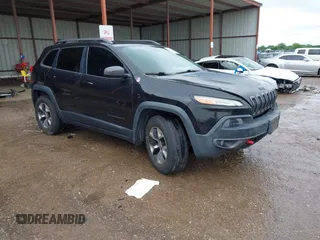 2015 Jeep Cherokee Trailhawk z VIN 1C4PJMBS3FW789249, wystawiony jako IAAI lot #42187224 z przebiegiem 141 663 mil mil oraz . Historia ofert i sprzedaży dostępna na DreamBid. Obrazek 1.