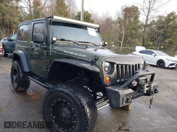 2009 Jeep Wrangler Rubicon z VIN 1J8GA64169L743008, wystawiony jako IAAI lot #41792451 z przebiegiem 142 414 mil mil oraz . Historia ofert i sprzedaży dostępna na DreamBid. Obrazek 1.