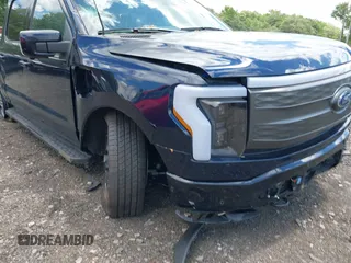 2023 Ford F-150 Lightning Pro с VIN 1FT6W1EVXPWG42428, выставлен на аукционе IAAI как лот 39711091 с пробегом 6 308 миль миль и . История ставок и продаж доступна на DreamBid. Изображение 22.