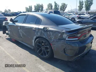 2019 Dodge Charger R/T z VIN 2C3CDXCT7KH527732, wystawiony jako IAAI lot #42283453 z przebiegiem 99 755 mil mil oraz . Historia ofert i sprzedaży dostępna na DreamBid. Obrazek 3.