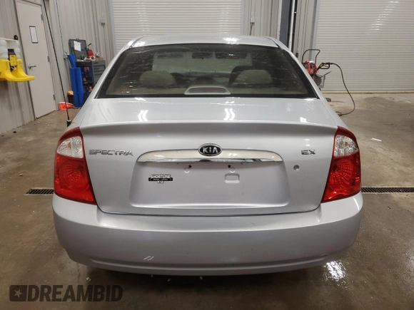 2005 Kia Spectra LX with VIN KNAFE121655148281, listed as a Copart auction lot 76677864 with 115,299 mi miles and Clean Title. Bid and sale history available at carsss.com. Image 6.