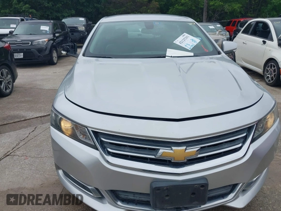2014 Chevrolet Impala LT with VIN 2G1125S33E9103583, listed as a IAAI auction lot 42125293 with 143,951 mi miles and . Bid and sale history available at DreamBid. Image 12.