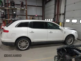 2013 Lincoln MKT EcoBoost with VIN 2LMHJ5AT3DBL56954, listed as a IAAI auction lot 41705877 with 148,771 mi miles. Bid and sale history available at carsss.com. Image 13.