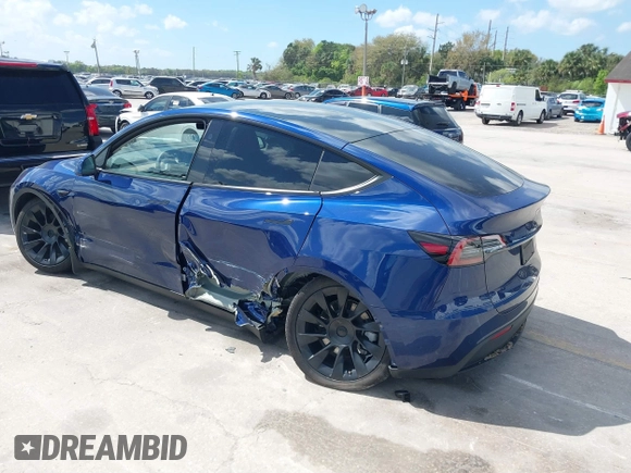 2023 Tesla Model Y Long Range with VIN 7SAYGDEE9PA205757, listed as a IAAI auction lot 41705881 with 18,567 mi miles and . Bid and sale history available at carsss.com. Image 3.