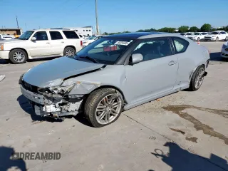 2012 Scion tC z VIN JTKJF5C75C3043706, wystawiony jako Copart lot #56204495 z przebiegiem 145 770 mil mil oraz Szkoda całkowita • Salvage title. Historia ofert i sprzedaży dostępna na DreamBid. Obrazek 1.