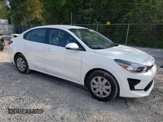 2023 Kia Rio S with VIN 3KPA24AD3PE597752, listed as a Copart auction lot 64836674 with 8,434 mi miles and Salvage Title. Bid and sale history available at carsss.com. Image 4.