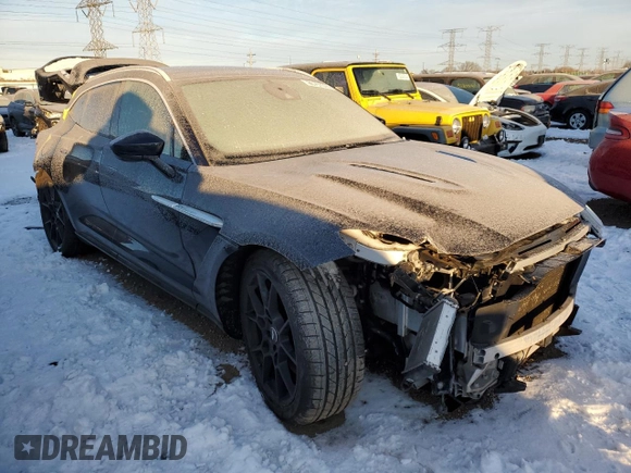 2021 Aston Martin DBX z VIN SCFVUJAW9MTV02708, wystawiony jako Copart lot #85731374 z przebiegiem Nie podano mil oraz Szkoda całkowita • Salvage title. Historia ofert i sprzedaży dostępna na DreamBid. Obrazek 4.