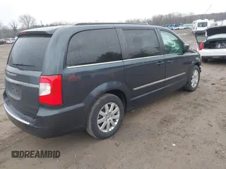 2014 Chrysler Town & Country Touring with VIN 2C4RC1BG6ER348090, listed as a IAAI auction lot 41687678 with 140,192 mi miles. Bid and sale history available at carsss.com. Image 4.