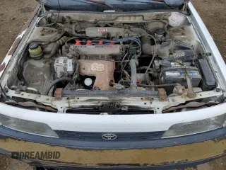 1991 Toyota Camry z VIN 4T1SV24E5MU355011, wystawiony jako Copart lot #51021185 z przebiegiem 135 881 mil mil oraz Czysty tytuł • Clean title. Historia ofert i sprzedaży dostępna na DreamBid. Obrazek 11.